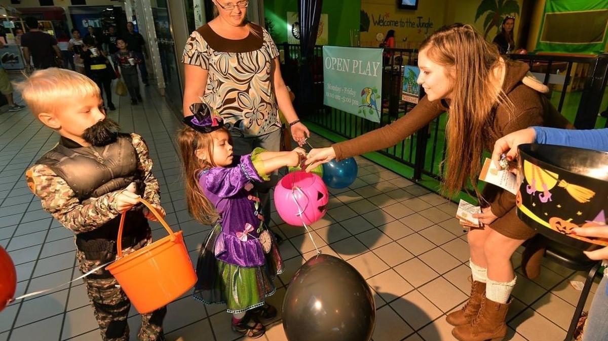 Costumed kids flock to one of many trick or treat activities in the Valley.