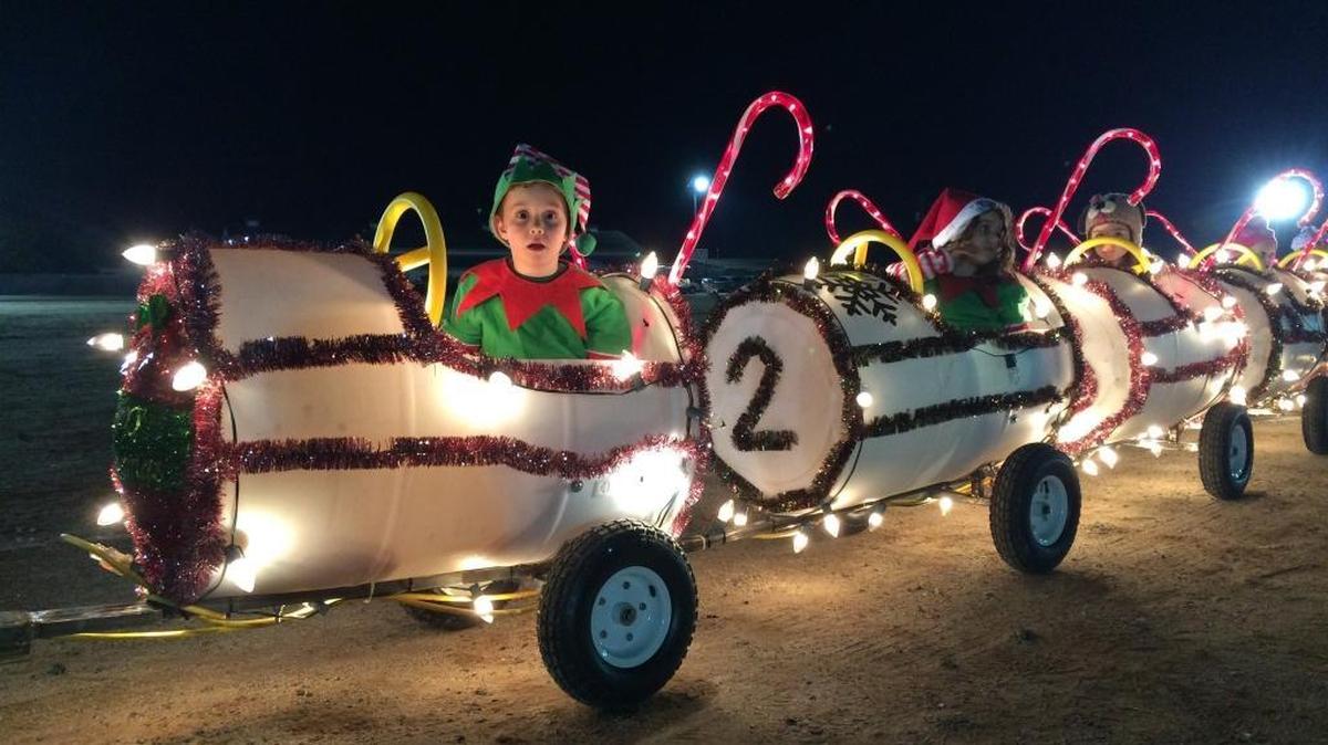 Children in a train await their turn to parade along the streets of Old Town Clovis in the Children’s Electric Christmas Parade.