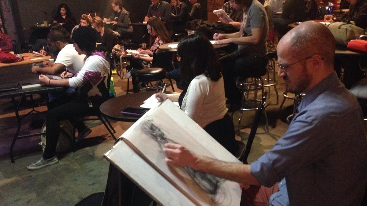 Caleb Henderson works on a piece at a Drink & Draw at Fulton 55. The next event is tonight.
