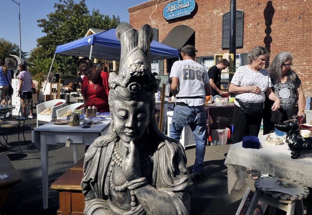 Visitors shop at one of more than 150 vendors during Glorious Junk Days in Old Town Clovis on Sunday, Oct. 19, 2014. The next event is Sunday, May 28.