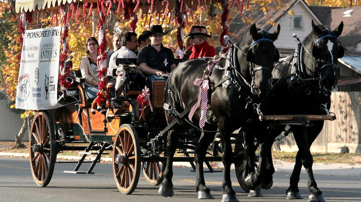 Families take an old fashioned horse-drawn ride through Old Town Clovis.