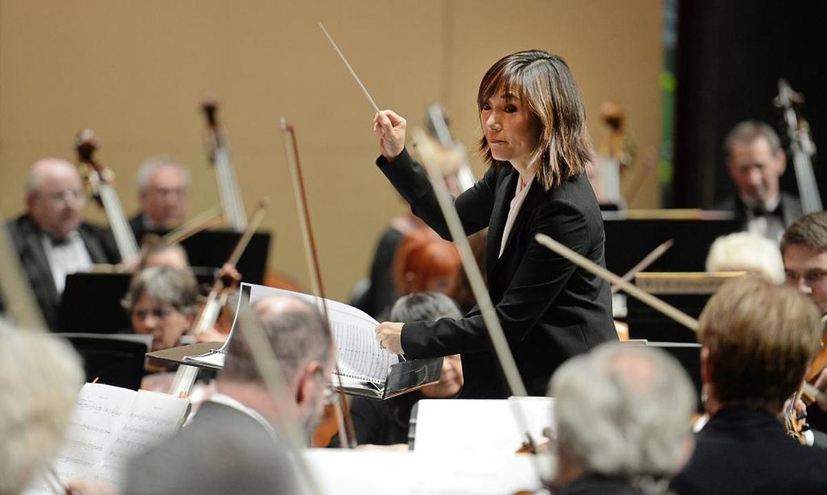 Rei Hotoda conducts the orchestra in her debut as conductor of the Fresno Philharmonic. She returns to the dais Sunday.