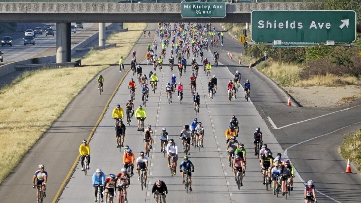 Cyclists ride east on the 168 Freeway near Shields Avenue in Fresno after the start of the California Classic bike ride in 2015.Sunnyside Bicycles is holding an event to offer training tips for this year’s event.