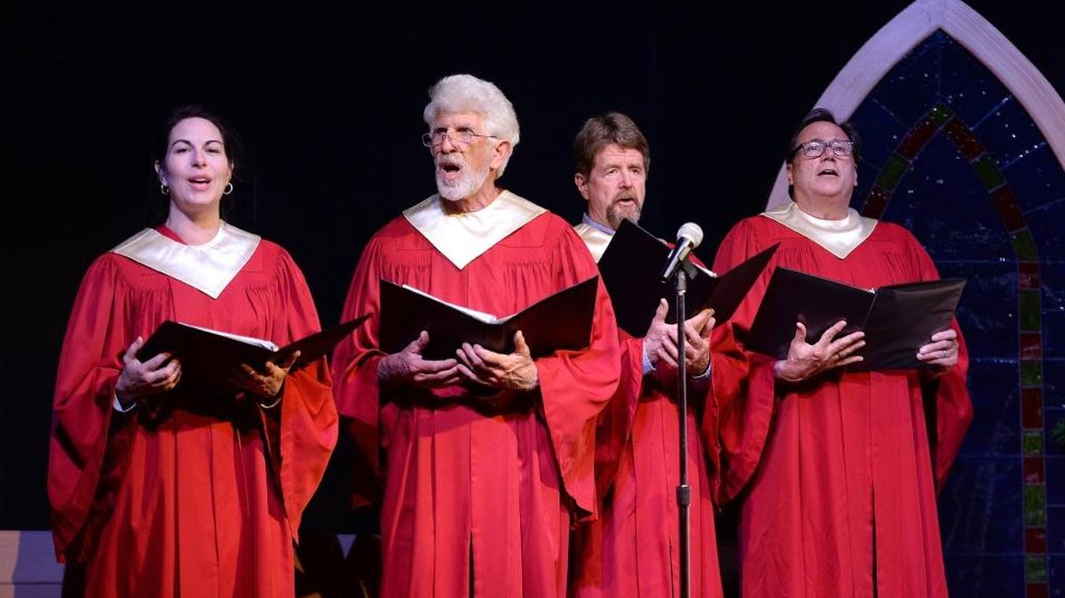 Members of the choir sing during a rehearsal for StageWorks Fresno’s production of “The Christians” at the Fresno Art Museum’s Bonner Auditorium.