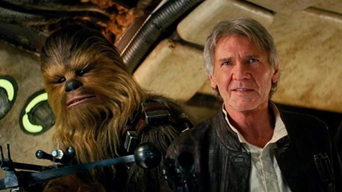 This photo provided by Lucasfilm shows Peter Mayhew as Chewbacca and Harrison Ford as Han Solo in “Star Wars: The Force Awakens,” directed by J.J. Abrams. Lawrence Kasdan co-wrote the screenplay with Abrams. “Star Wars” isn’t just strong. It’s unstoppable. The revival of the nearly 40-year-old space saga has already dominated the box office and toy shelves. Now, it’s also been selected as The Associated Press Entertainer of the Year and is amassing support for Academy Awards consideration.