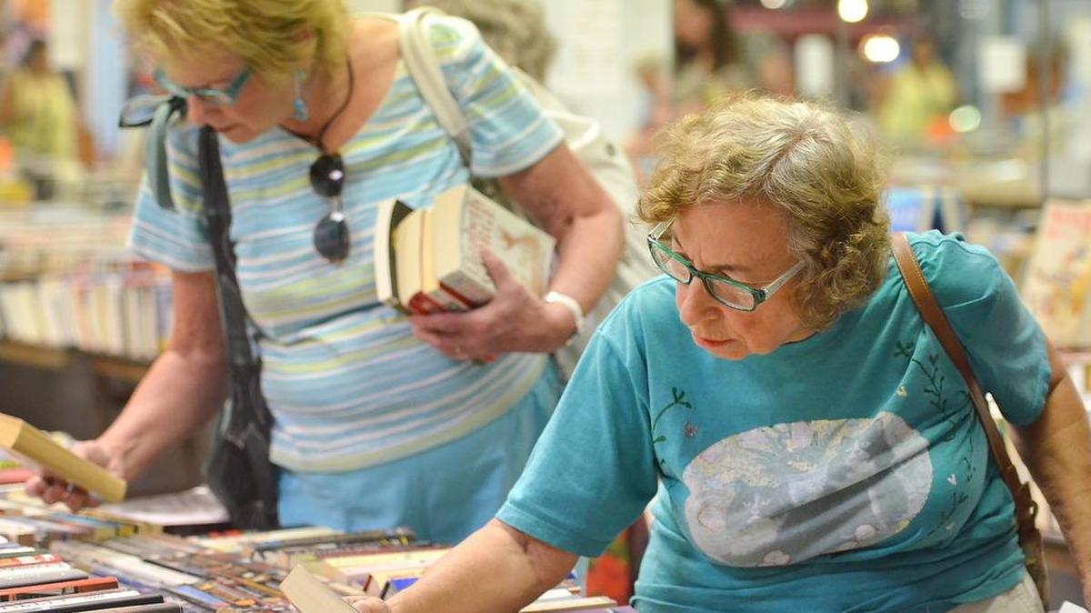 
Marilyn Goldsmith, right, of Clovis, and Linda Hubbart, of Fresno, browse through tables of books at The Friends of the Fresno County Public Library’s fifth annual Big Book Sale at Sierra Vista Mall in Clovis. Check out the event through Sunday.
