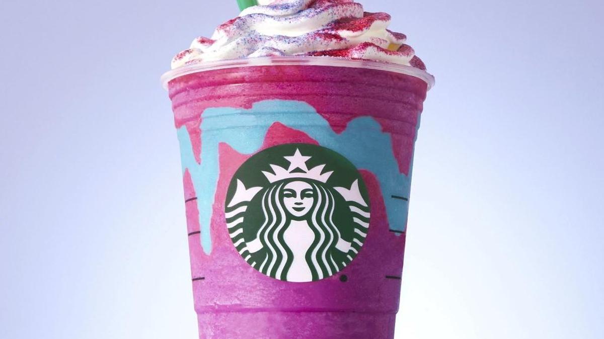 This photo provided by Starbucks shows the company's Unicorn Frappuccino. Starbucks says its newest beverage not only changes colors with a stir of the straw, but flavors as well. The Seattle chain says its Unicorn Frappuccino starts as a purple drink with blue swirls that tastes sweet and fruity, before changing to pink with a tangy and tart taste with a stir of the straw. The company says the drink is available for a limited time while supplies last, from April 19 to April 23, 2017, in the United States, Canada and Mexico. (Starbucks via AP)