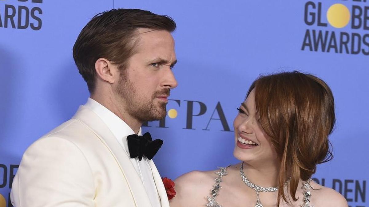 Ryan Gosling, left, and Emma Stone pose in the press room with the award for best performance by an actor and actress in a motion picture - musical or comedy for "La La Land" at the 74th annual Golden Globe Awards. But was the movie really that good. The Fresno Beehive discusses in episode one of its new podcast.