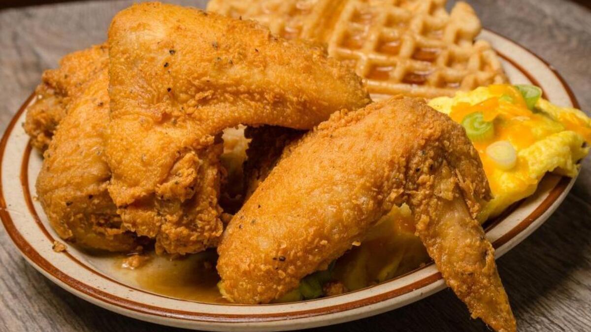 Chef Paul’s Cafe in downtown Fresno serves up some of the best chicken and waffles. It is possible to get them with scrambled eggs and onions with melted cheese on top for a hearty breakfast.