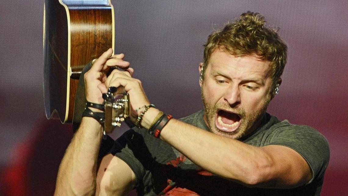 Country music artist Dierks Bentley swings his guitar around while performing at the Save Mart Center Thursday, August 20, 2015. The singer will return to the arena in 2017 on his just announced What the Hell tour.
