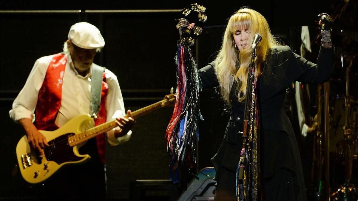 John McVie plays bass as Stevie Nicks sings vocals with Fleetwood Mac during their concert An Evening with Fleetwood Mac at the Save Mart Center in Fresno on Thursday, Dec. 6, 2018.