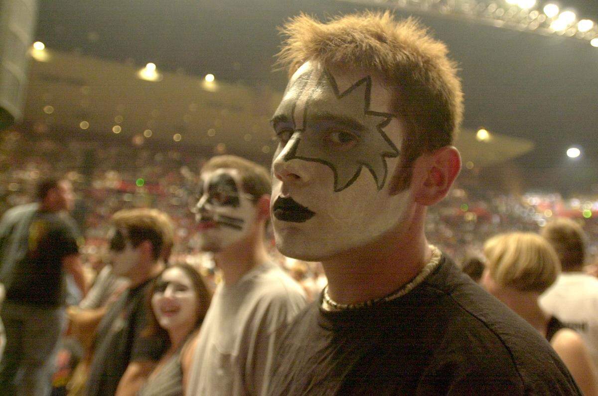 FRESNO 8-1-00 ZN FNN KISS Nick Grim donned some makeup for the KISS concert in Fresno. Grim was one of the many people who showed up to watch the band’s farewell tour. Neighbors Newspapers