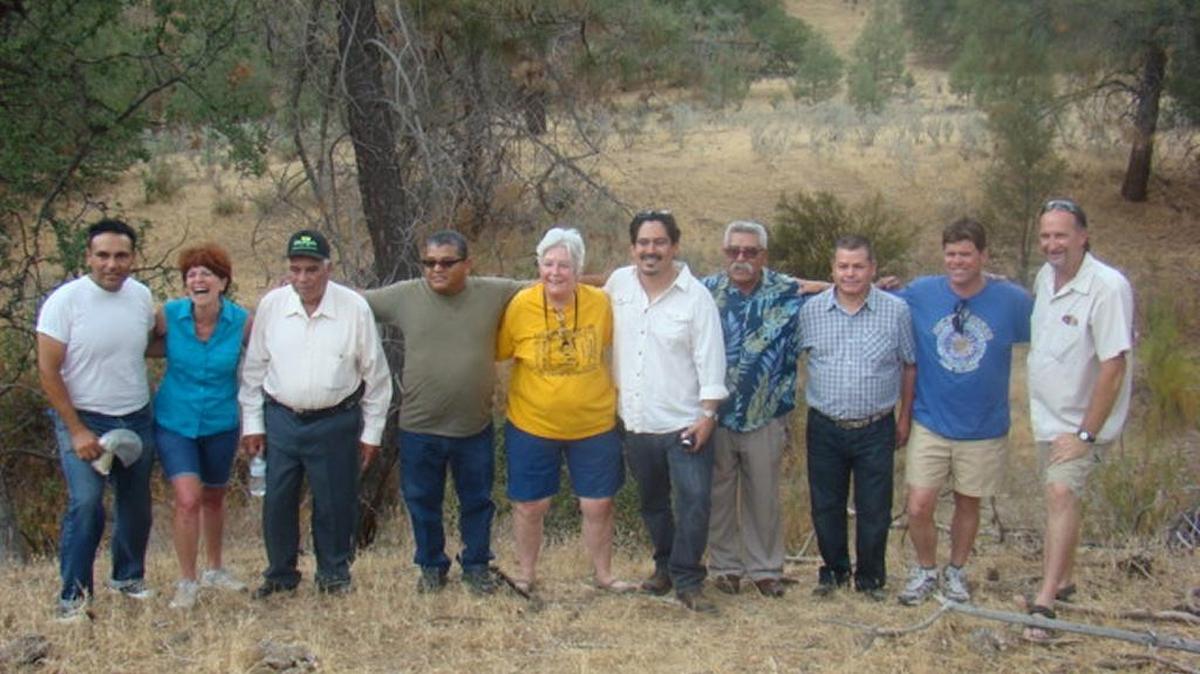 Author Tim Z. Hernandez, fifth from right, visited the site of a 1948 crash that killed 32 people with some of the victims’ relatives.