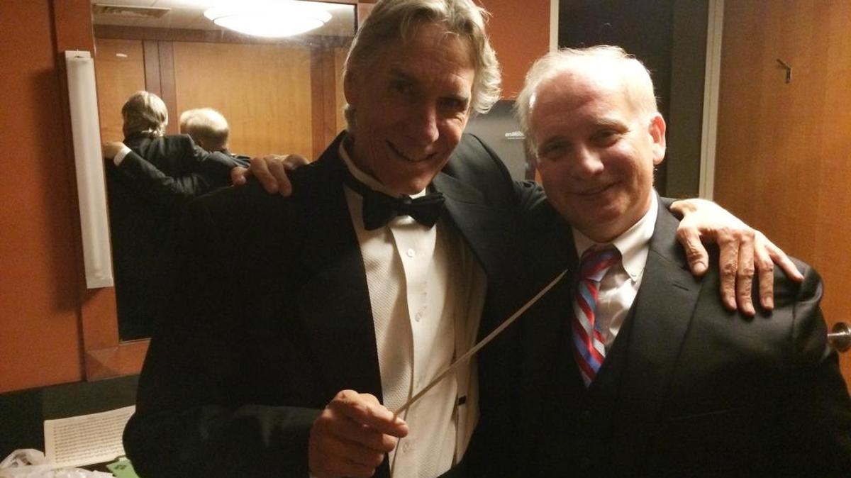 Bass player Randy Keith, left, with conductor Theodore Kuchar after the Cirque de la Symphonie concert.