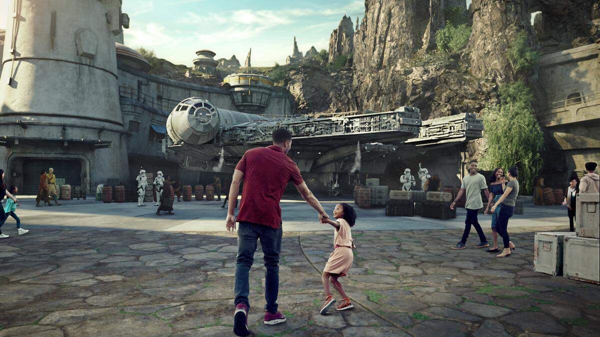 Star Wars: GalaxyÕs Edge will open May 31, 2019, at Disneyland Park in Anaheim, California, and August 29, 2019, at Disney’s Hollywood Studios in Lake Buena Vista, Florida. At 14 acres each, Star Wars: GalaxyÕs Edge will be Disney’s largest single-themed land expansions ever, transporting guests to live their own Star Wars adventures in Black Spire Outpost, a village on the remote planet of Batuu, full of unique sights, sounds, smells and tastes. Guests can become part of the story as they sample galactic food and beverages, explore an intriguing collection of merchant shops and take the controls of the most famous ship in the galaxy aboard Millennium Falcon: Smugglers Run. (Disney Parks)