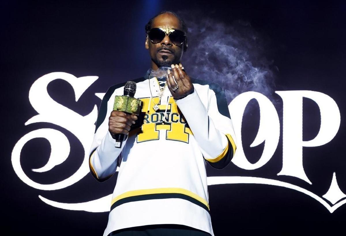 Snoop Dogg exhales smoke as he performs on the second and last day of Grizzly Fest 2018 Saturday, May 19, 2018 in Fresno.