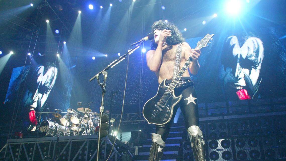 Paul Stanley, center, is framed by monitors projecting KISS bass player Gene Simmons during the KISS concert at the Save Mart Center on Dec. 20, 2003 in Fresno.