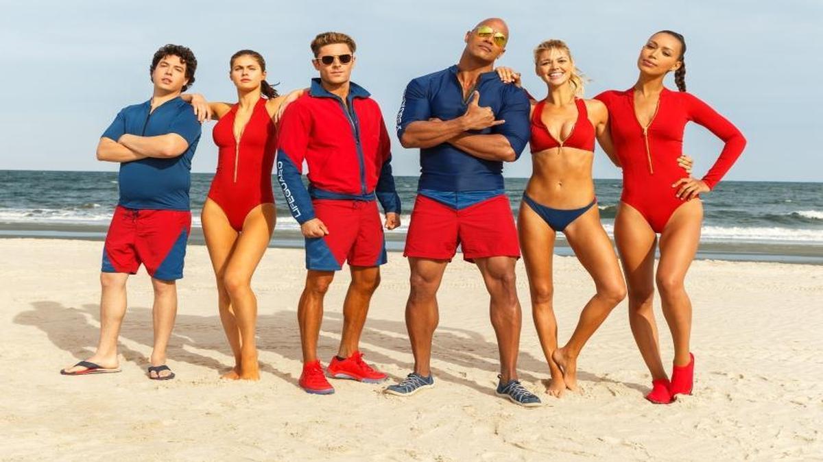 Jon Bass plays Ronnie, Alex Daddario plays Summer, Zac Efron plays Matt Brody, Dwayne Johnson plays Mitch Buchannon, Kelly Rohrbach plays CJ Parker, and Ilfenesh Hadera plays Stephanie Holden in “Baywatch,” the film by Paramount Pictures.
