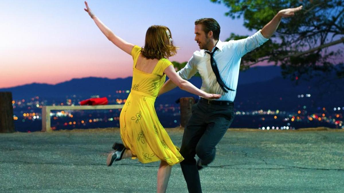 This image released by Lionsgate shows Ryan Gosling, right, and Emma Stone in a scene from, “La La Land.”