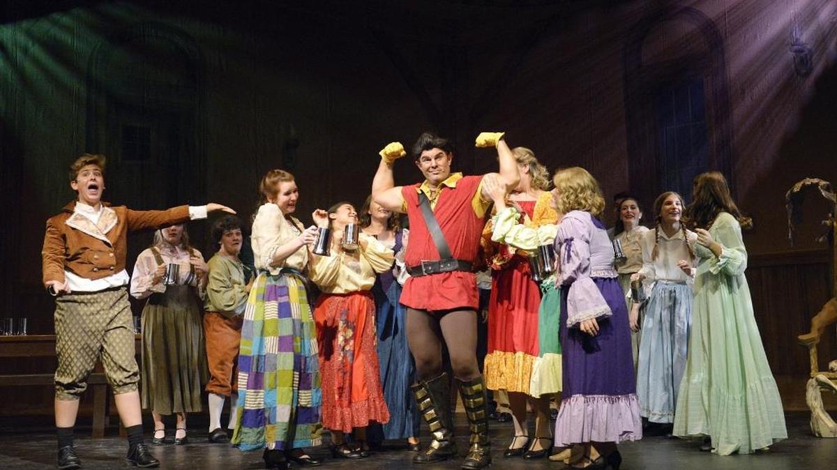 Nick Netzley, center, plays Gaston as he and the ensemble rehearse a scene for CenterStage Clovis Community Theatre’s production of “Disney’s Beauty and the Beast” at the Mercedes Edwards Theatre in Clovis, Monday, July 11.