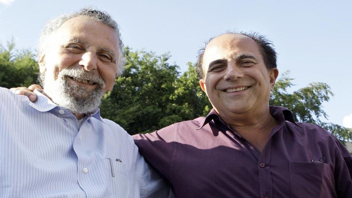 Brothers Tom Magliozzi, left, and Ray Magliozzi, hosts of National Public Radio's "Car Talk" show, pose together in Cambridge, Mass., on Thursday, June 19, 2008. NPR will stop airing the show Sept. 30, 2017.