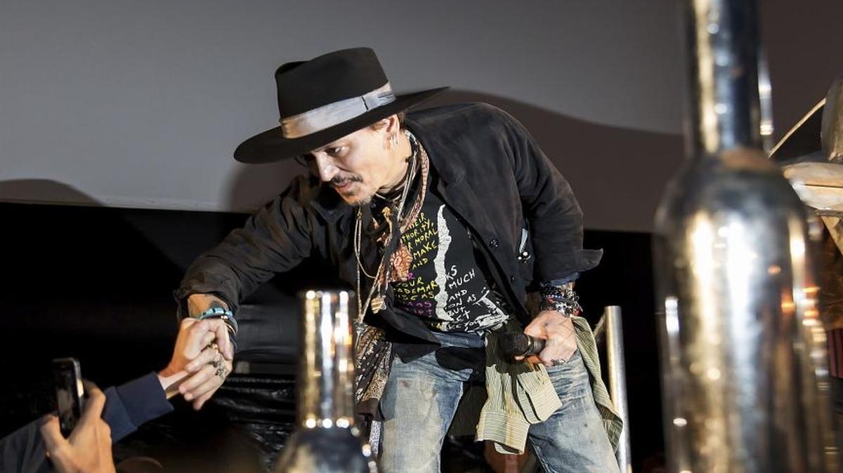 Johnny Depp greets fans at the Glastonbury music festival at Worthy Farm, in Somerset, England, Thursday, June 22, 2017. The actor made news for his odd remarks at the festival.