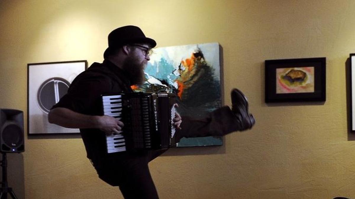 Strangely, a fringe festival performance artist, performs his “Joy Compactor” show at Fulton Street Art, Sunday, March 5, 2017 in Fresno, Calif.