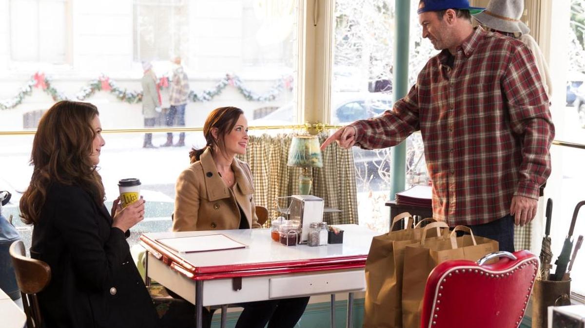 A “Gilmore Girls”-themed event will give out free coffee at Yellow Mug Coffee the morning of Wednesday, Oct. 5. Netflix is sponsoring the event because it’s relaunching the show as four 90-minute episodes called “Gilmore Girls: A Year in the Life.” Pictured, from left to right, Lauren Graham as Lorelai Gilmore, Alexis Bledel as Rory Gilmore and Scott Patterson as Luke’s Diner owner Luke Danes.