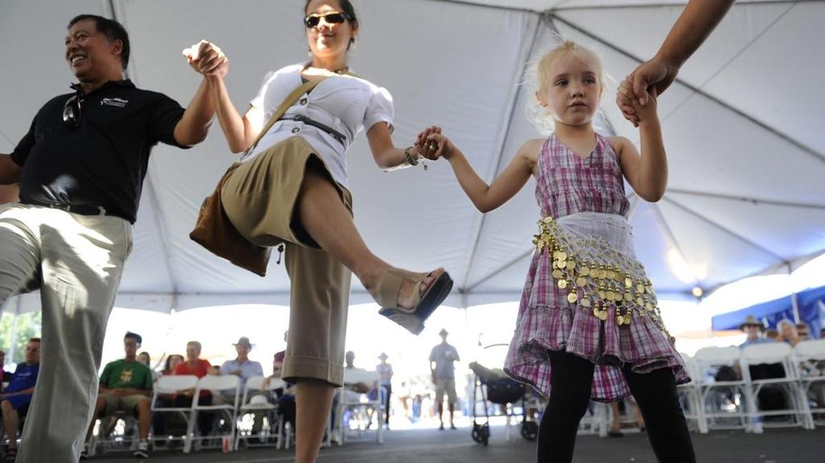
In the 2013 file photo, Mildred Deeming, 4, watches those around her as she follows instructions on Greek dancing at the Fresno Greek Fest. This year’s festival kicks off Friday, Aug. 28, at St. George Greek Orthodox Church.
