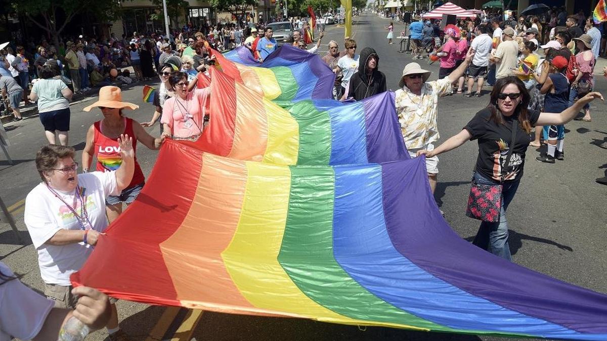 Members of the First Congregational Church of Fresno hold a large rainbow flag while marching in the parade at the 26th Pride Parade and Festival in Fresno Tower District, Saturday, June 4, 2016. This year’s parade happens Saturday, June 3.