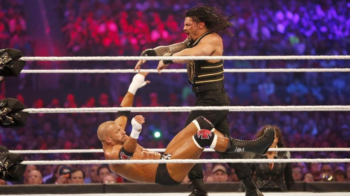 Roman Reigns, seen here wrestles Triple H during WrestleMania 32, will be competing at Save Mart Center on the Road to WrestleMania 2018.