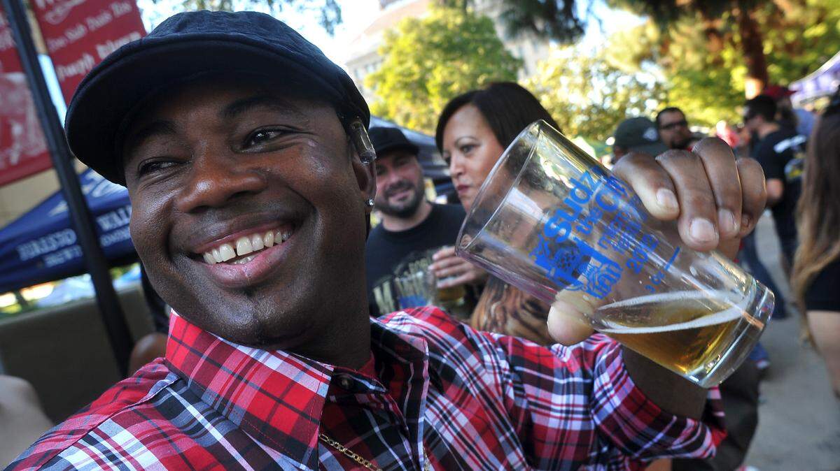 Chester Roberts socializes with friends while sampling brews during the Sudz in the City beer fest on the Fulton Mall, Saturday afternoon,  October 20, 2012. The event returns Sept. 22, 2018.