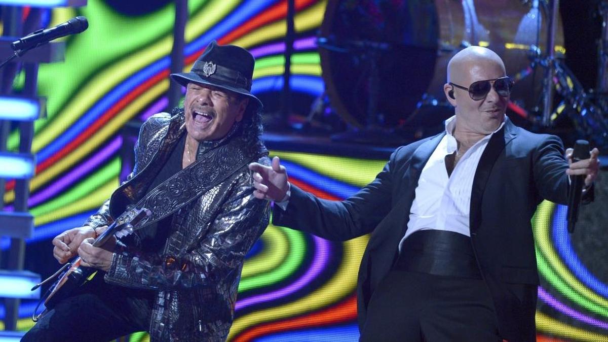 Pitbull, seen here at the Latin Grammy awards, will perform in Fresno in July.