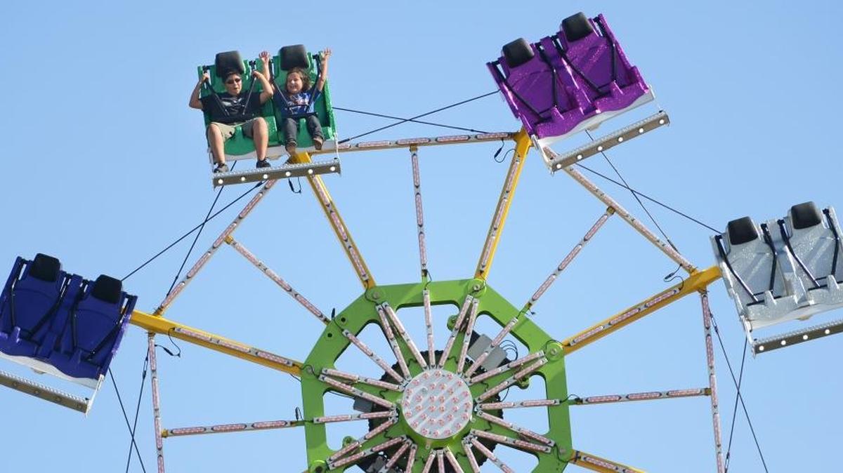
Fairgoers ride the Rampage ride in the carnival area of the Caruthers District Fair in 2013. This year’s fair kicks off Wednesday, Sept. 30. 
