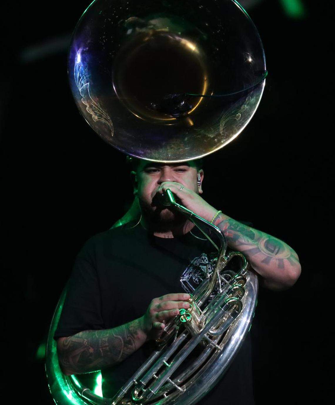 José Oritz, tuba player for Fuerza Regida, performs before a sellout crowd at the Save Mart Center on Aug. 5, 2023.