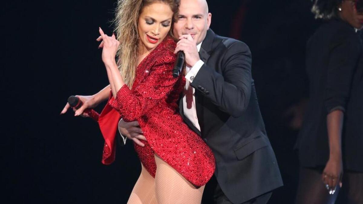 Jennifer Lopez, left, is embraced by Pitbull at the end of her performance at the 42nd annual American Music Awards in Los Angeles. Pitbull kick off his North American tour, Wednesday, July 6, at the Save Mart Center in Fresno.