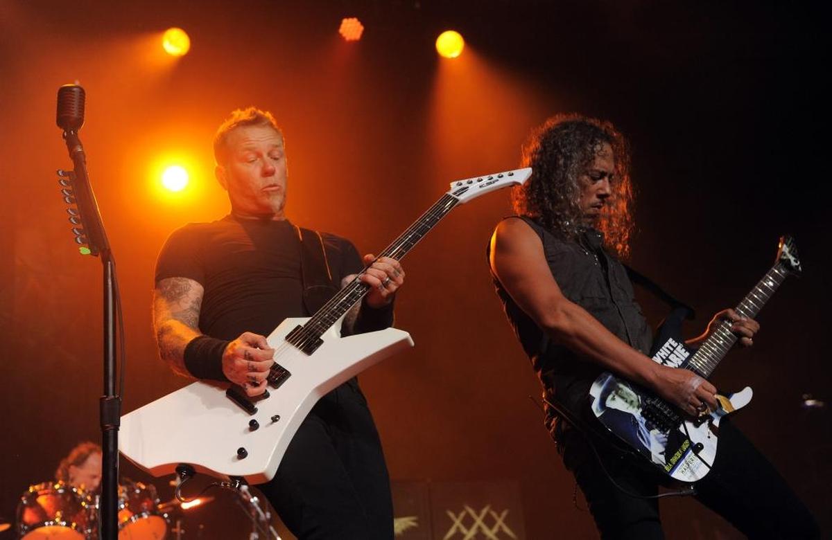 In this 2013 file photo, James Hetfield, left, and Kirk Hammett of Metallica perform on at Comic-Con International Convention.