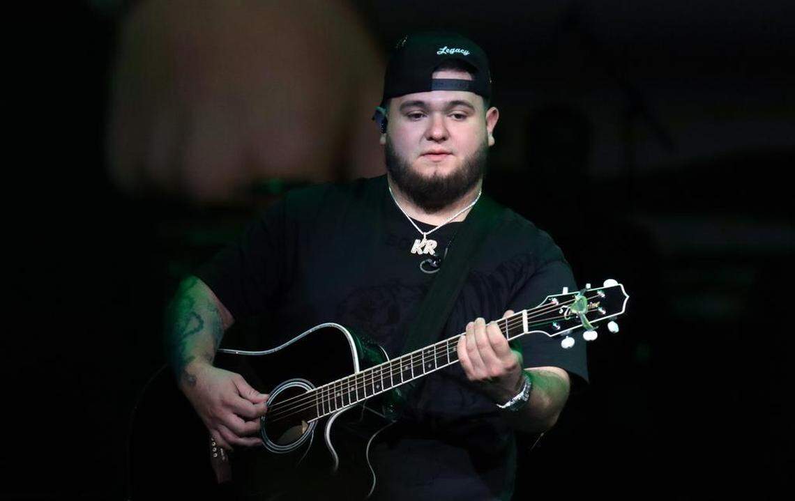Khrystian Ramos, guitarist for Fuerza Regida, performs before a sellout crowd at the Save Mart Center on Aug. 5, 2023.
