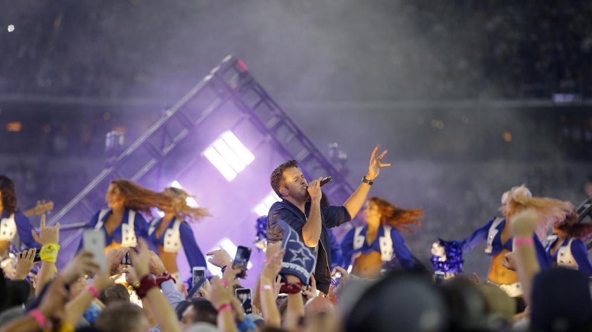 Luke Bryan performs in the Salvation Army Red Kettle Kickoff Concert at halftime of and NFL football game between the Carolina Panthers and the Dallas Cowboys, Thursday, Nov. 26, 2015, in Arlington, Texas. The singer will bring his “Lights Out Tour” April 30 to the Save Mart Center. Tickets go on sale 10 a.m. Dec. 11.