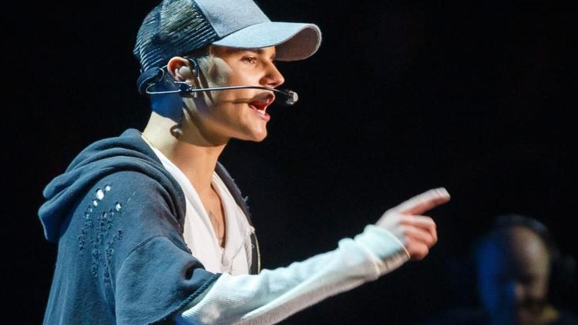Singer Justin Bieber gestures as he stands on stage during a concert in Oslo, Thursday Oct. 29, 2015.