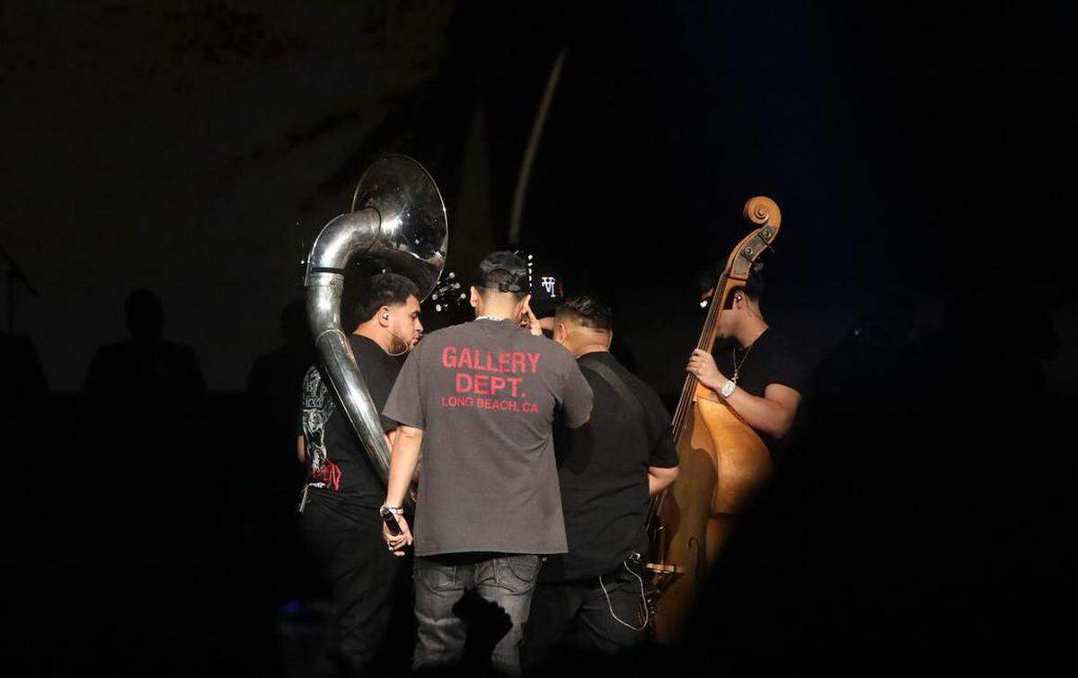 The four members of Fuerza Regida finish a song during their “Otra Peda” tour stop at the Save Mart Center on Aug. 5, 2023.