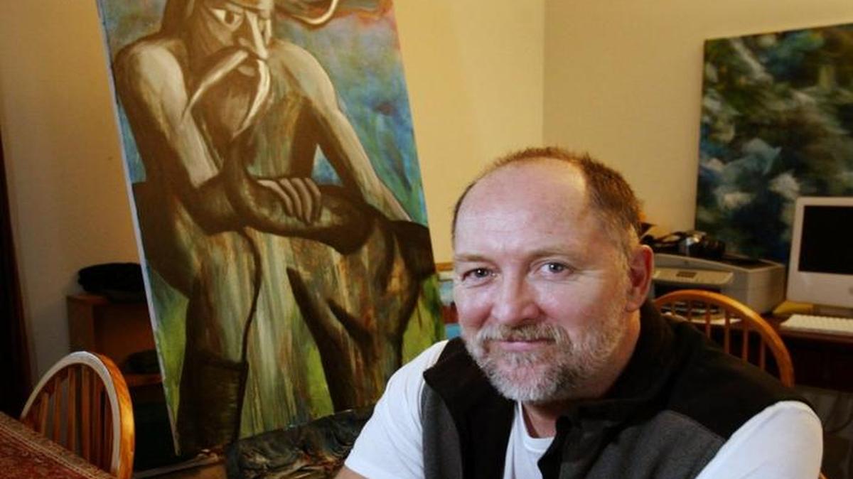 In a 2005 file photo, artist Russell Johnston poses with a piece called “First Biker.” Johnston has an exhibit through Sept. 29 at Studio 74.