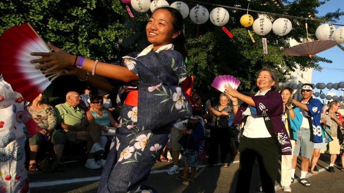 Leslie Tamura, left, joins others performing traditional Japanese dance during the 2009 Obon Festival at the Fresno Buddhist Temple. The 72nd annual event is tonight.