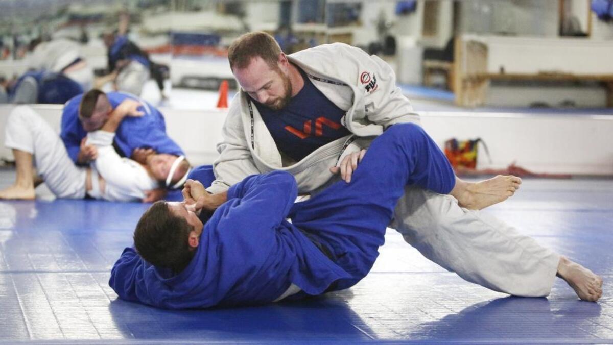 Cameron Baird spars with Ryan Walker at Pacific Martial Arts in Fresno which features classes in karate, judo, jiu jitsu, eskrima, boxing, wrestling and more.
