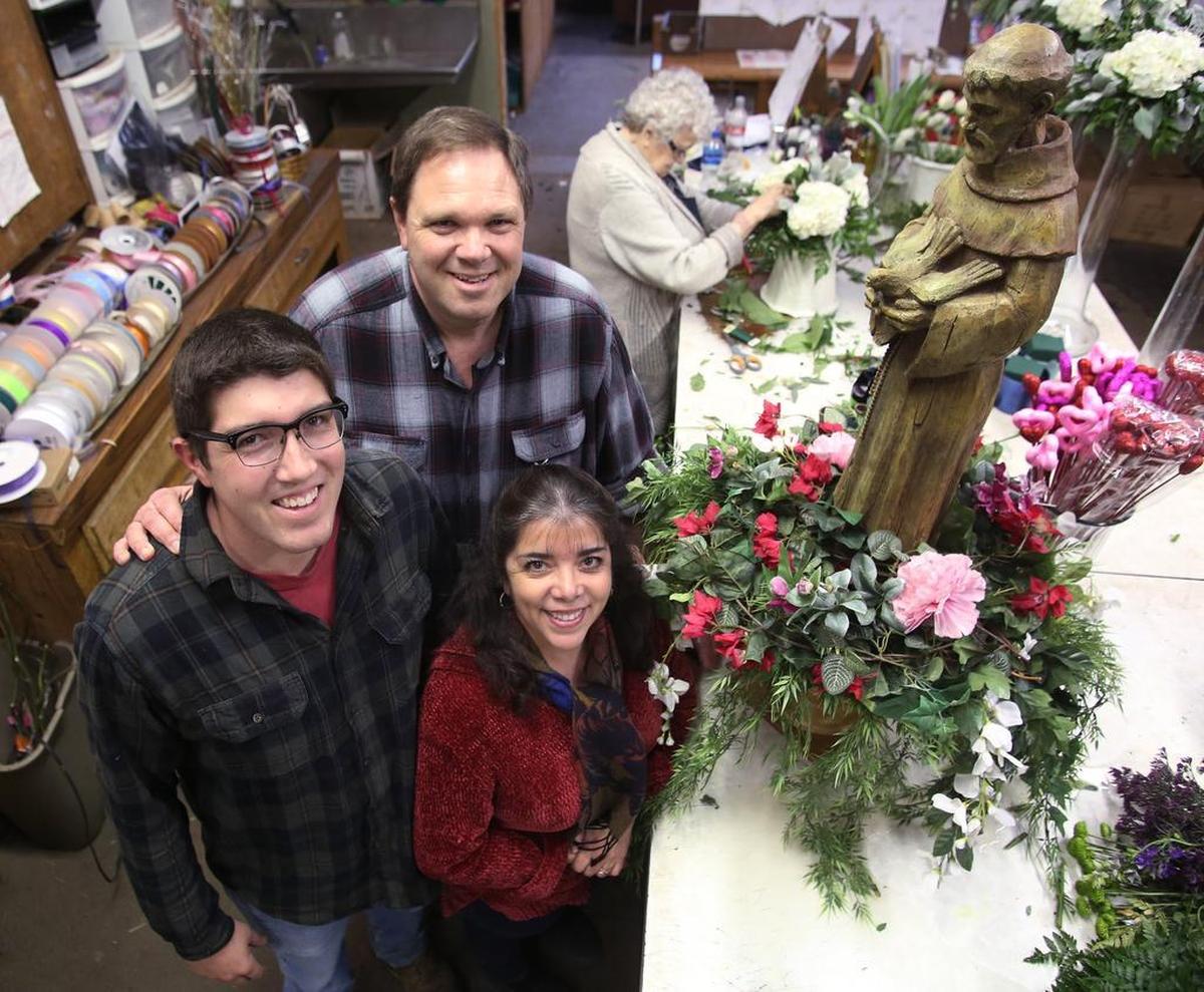FLORAL SHOP: Andy Azzaro in back, shown with his son Nico and wife Linda, is the owner of San Francisco Floral, which has been handed down through several generations and is a People's Choice winner. Not pictured is his daughter, Bianca.