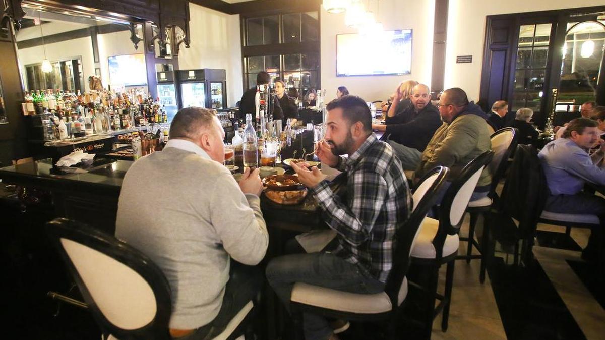 Mochuelo offers a unique dining experience for tapas in the Piccadilly Inn as Barry Falke, left, and AJ Griem enjoy the bar area Friday, Feb. 22 2019 in Fresno.