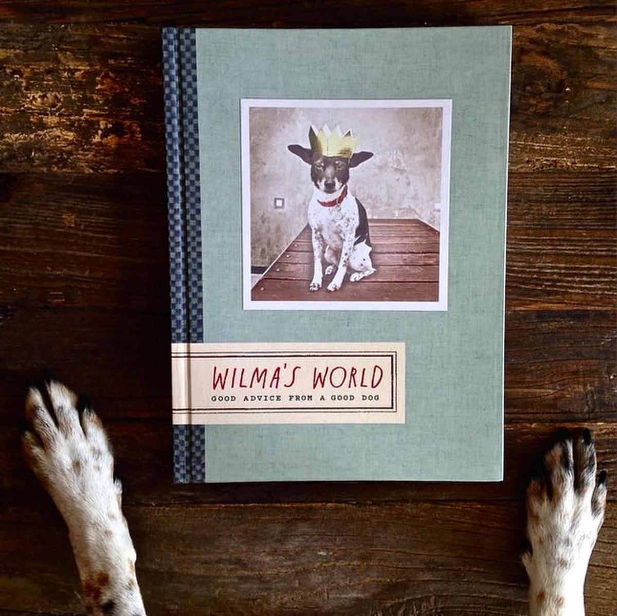WIlma gets to look at a copy of a book that features photos of her.