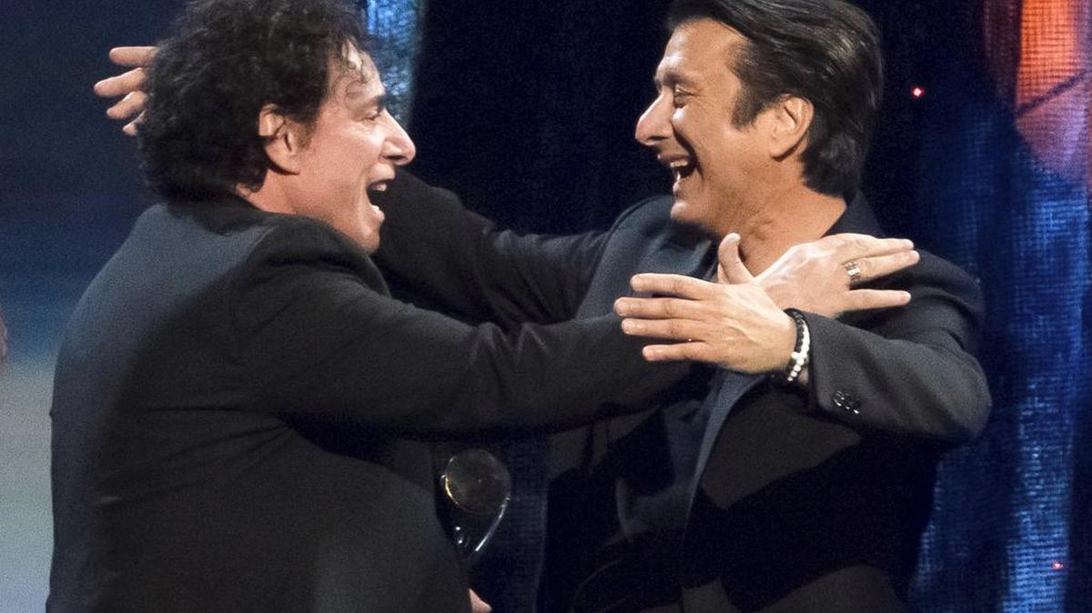 Inductees Neal Schon, left, and Steve Perry from the band Journey embrace at the 2017 Rock and Roll Hall of Fame induction ceremony Friday at the Barclays Center in New York.