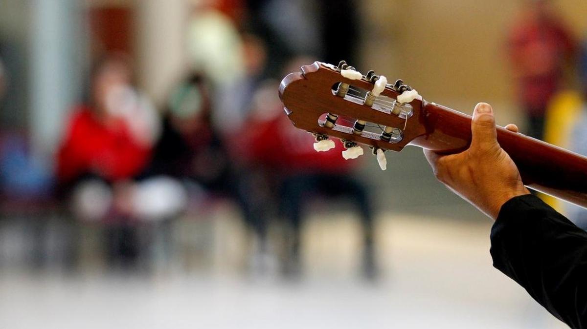 Fresno State students perform a guitar recital.