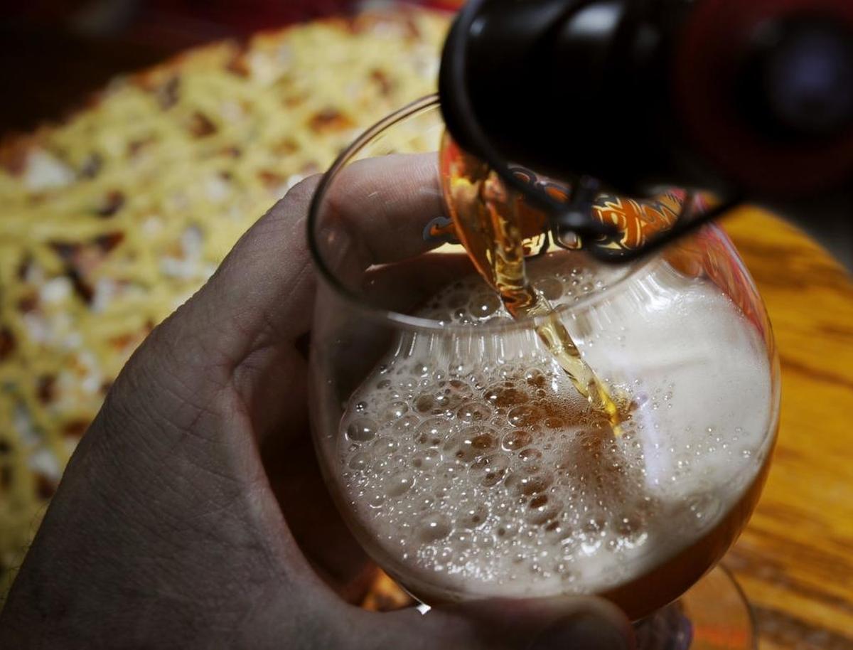 A rich head forms as a beer is poured at BC’s Pizza & Beer.